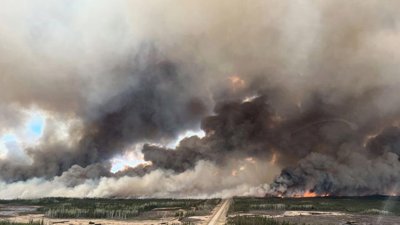 Yukon Wildfires Crews Protect Dawson City Homes